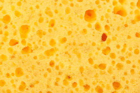 Background of yellow washcloths for the shower closeup
