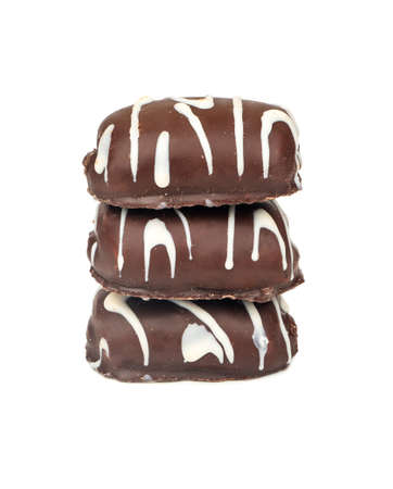 Three chocolate chip cookies with icing on white backgroundの写真素材