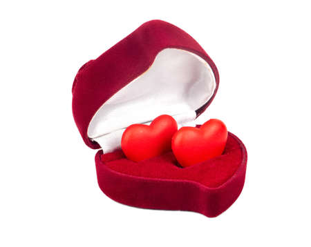 Engagement ring box with hearts isolated on white backgroundの写真素材