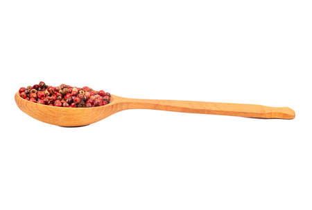 Red pepper peas in a wooden spoon on a white backgroundの写真素材