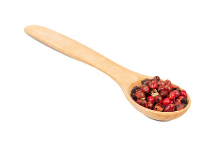 Small spoon with red pepper peas isolated on white backgroundの写真素材