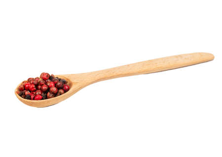 Small spoon with red pepper peas isolated on white backgroundの写真素材