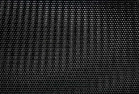 Blue background of metal mesh in the hole close-upの写真素材