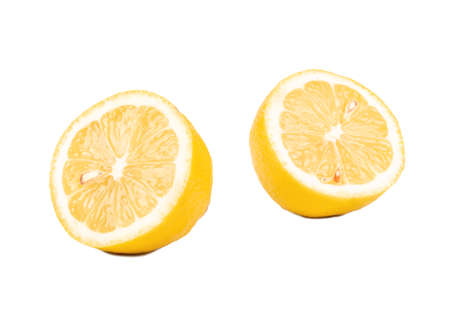Lemon cut into two halves on a white backgroundの写真素材