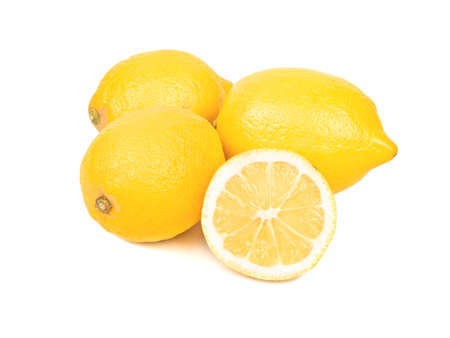 Three lemons with half on white backgroundの写真素材
