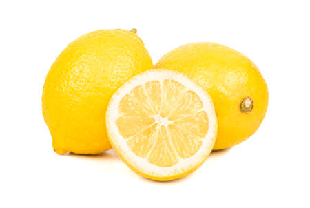 Two lemons with half on white backgroundの写真素材