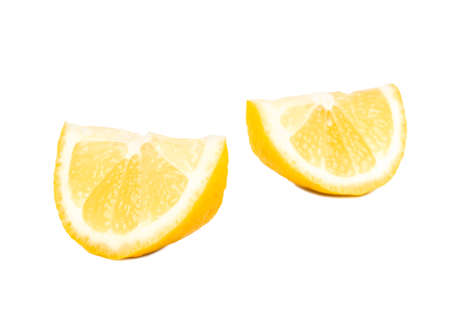 Two slices of lemon fruit on white backgroundの写真素材