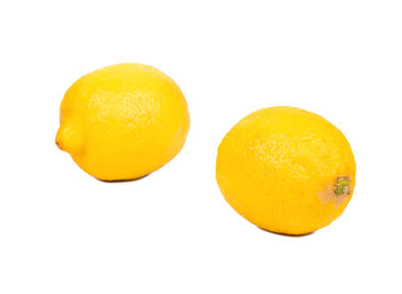 Two fresh lemon fruits isolated on white backgroundの写真素材