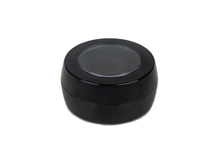 Black plastic cosmetic jar isolated on white backgroundの写真素材