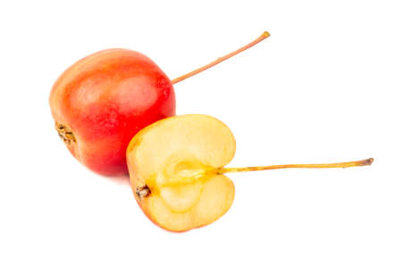 Red paradise apple with half on white backgroundの写真素材