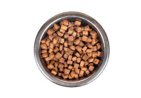 Iron bowl of food for animals isolated on a white background, top viewの写真素材