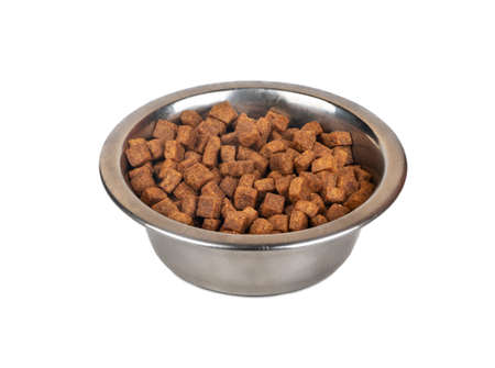 Iron bowl of food for animals isolated on a white backgroundの写真素材