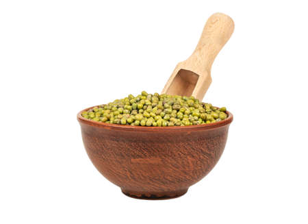 Bowl with green mung beans and wooden scoop on white backgroundの写真素材