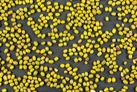 Scattered green grain mash on a concrete background, top viewの写真素材