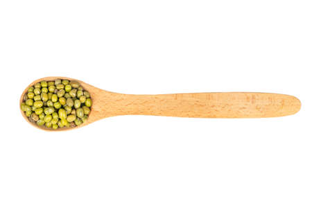 Spoon with dried green mung bean isolated on white background, top viewの写真素材
