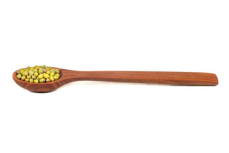 Green grain mash in spoon isolated on white backgroundの写真素材