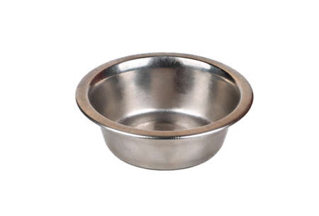 Iron empty animal feed bowl isolated on white backgroundの写真素材