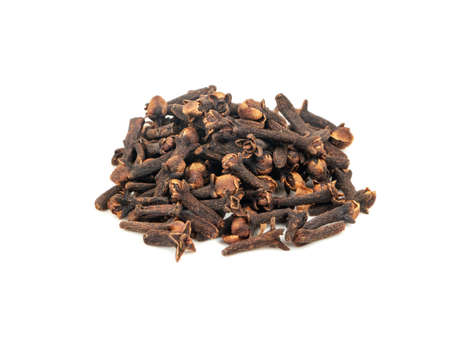 Pile of dry cloves on white backgroundの写真素材