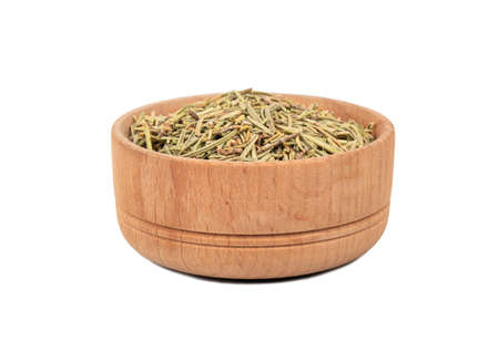 Wooden bowl with dry rosemary isolated on white backgroundの写真素材