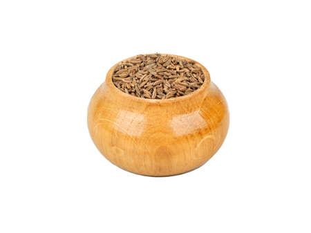 Cumin spice in wooden container isolated on white backgroundの写真素材
