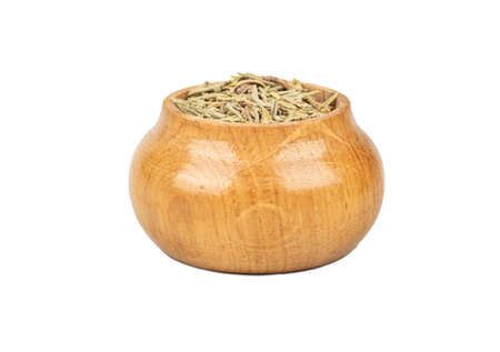 Dry rosemary in wooden container isolated on white backgroundの写真素材
