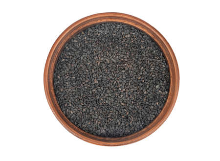 Large ceramic bowl with black sesame isolated on white background, top viewの写真素材