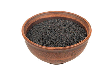 Large ceramic bowl with black sesame isolated on white backgroundの写真素材