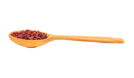 Large wooden spoon with dry barberry berries on white backgroundの写真素材