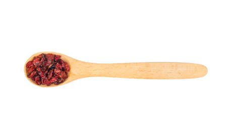 Small spoon with dry barberry isolated on white background, top viewの写真素材