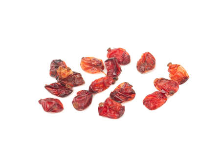 Scattered dry red barberry on a white backgroundの写真素材