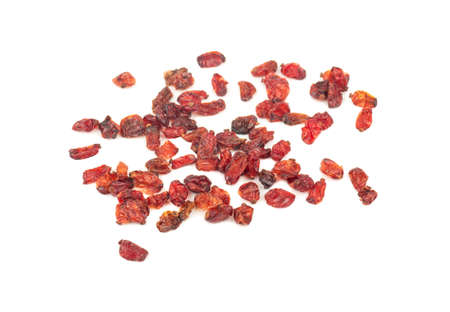 Scattered dry red barberry on a white backgroundの写真素材