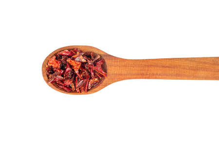 Wooden spoon with pieces of dry red pepper on white background, top viewの写真素材