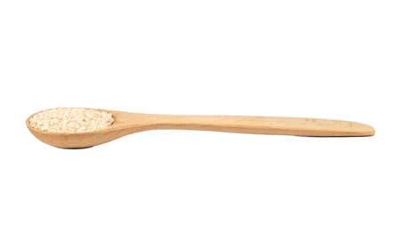 Small spoon with sesame seeds on white backgroundの写真素材