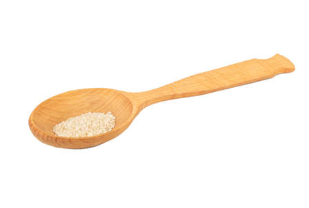Large spoon with sesame seeds isolated on white backgroundの写真素材