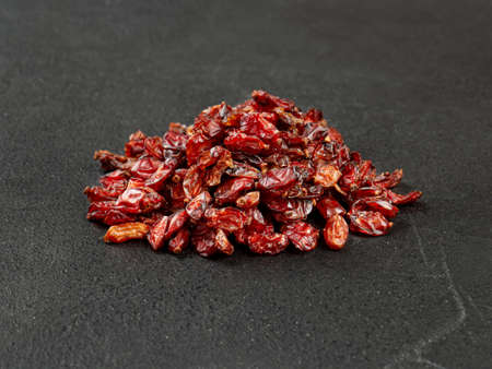 Pile of dry barberry on a dark backgroundの写真素材