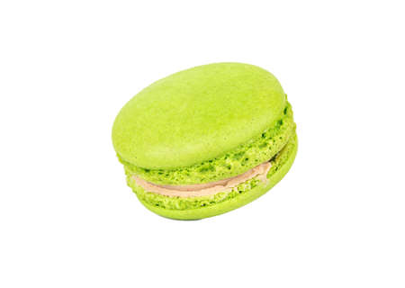 Green pistachio macaroon isolated on white backgroundの写真素材