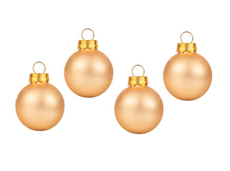 Four beige Christmas balls isolated on white backgroundの写真素材