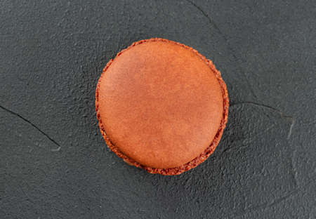Sweet chocolate macaroon on dark background, top viewの写真素材