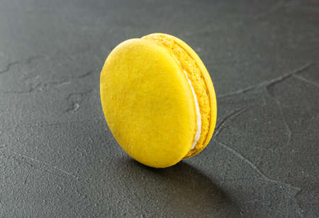 Delicious lemon macaroon on concrete backgroundの写真素材
