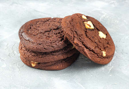 Homemade chocolate cookies with coconut on a concrete backgroundの写真素材