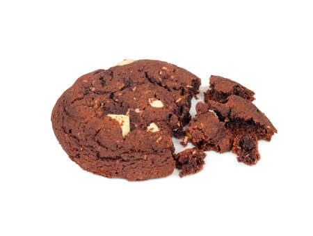 Broken homemade chocolate cookies on a white background