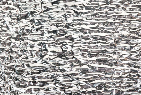 Background of washed silver foil close upの写真素材
