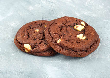 Homemade chocolate cookies with coconut on a concrete backgroundの写真素材