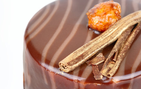 Piece of chocolate brownie with salted caramel and cookies inside. Decorated with nuts around the edges. close upの写真素材