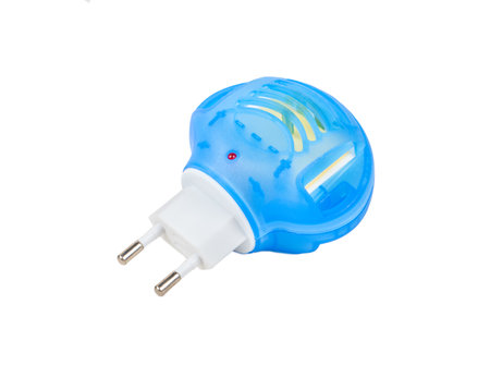 Blue fumigator for repelling mosquitoes in a socket with an euro plug isolated on a white background.の写真素材