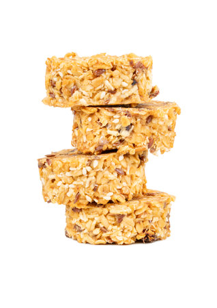 Stack of granola cookies with healthy cereals and grains in honey isolated on white backgroundの写真素材