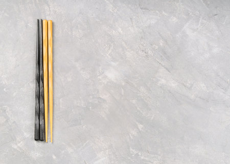 Chinese chopsticks on a blank gray background, top view, copy spaceの写真素材