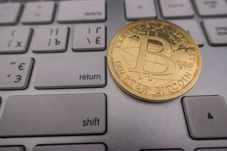 bitcoin souvenir coin on keyboard