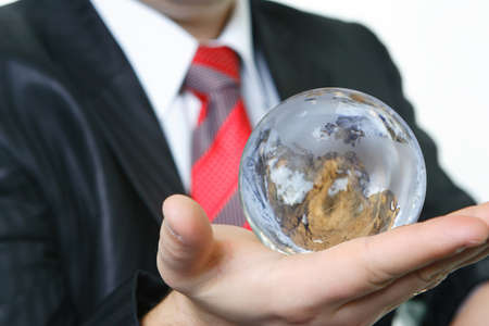 The businessman has control over globe in environment protectionの写真素材