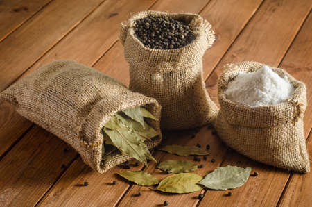 Salt, pepper and bay leaf in pouchesの写真素材